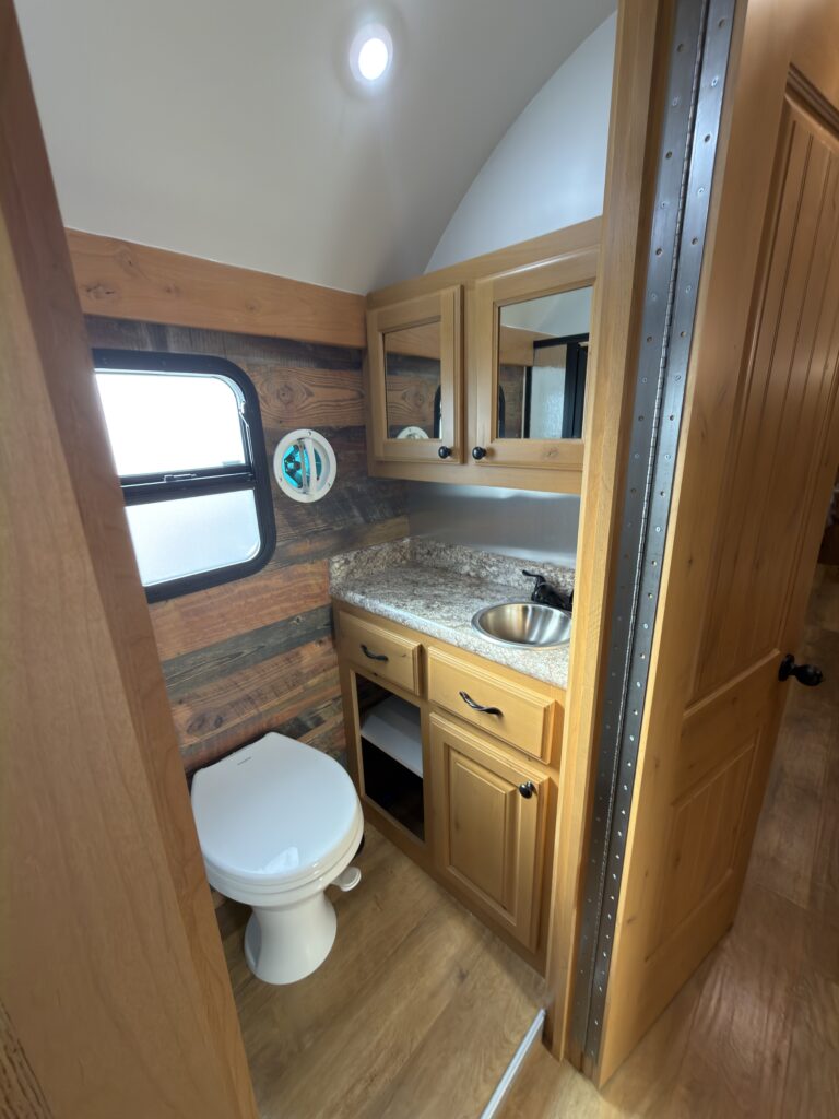 Image of the bathroom vanity and toilet of Gail Camp #131.