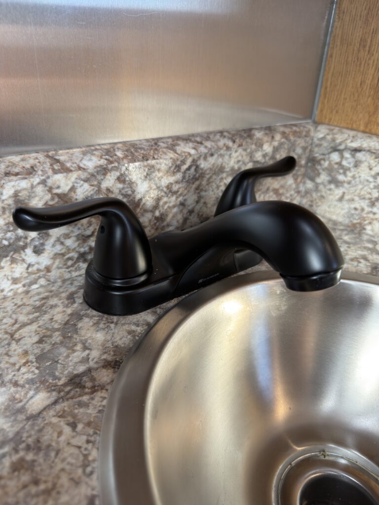 Image of the bathroom faucet and sink of Gail Camp #131.