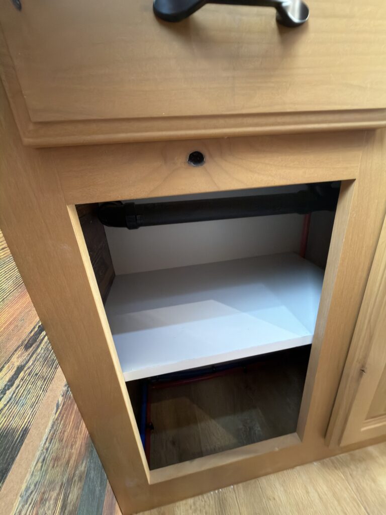 Image of the bathroom cabinet opening of Gail Camp #131.