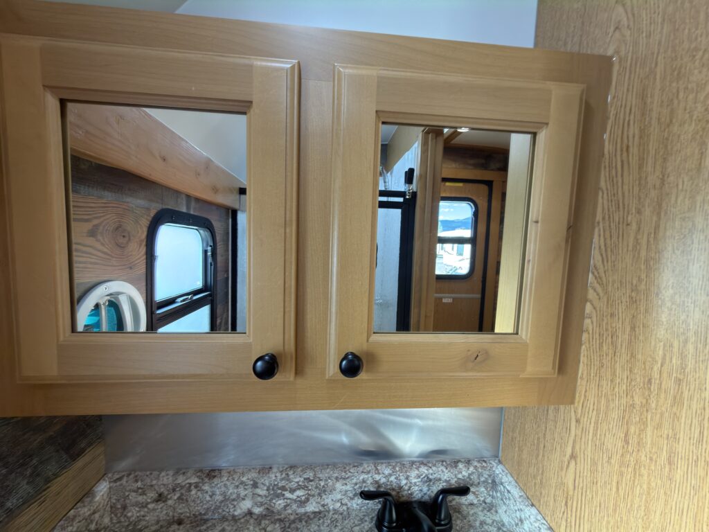 Alternate view of the mirrored bathroom cabinets of Gail Camp #131.