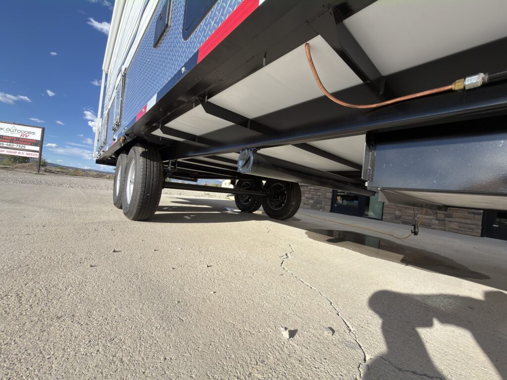 Image of the trailer underbody and utility lines of Gail Camp #131.