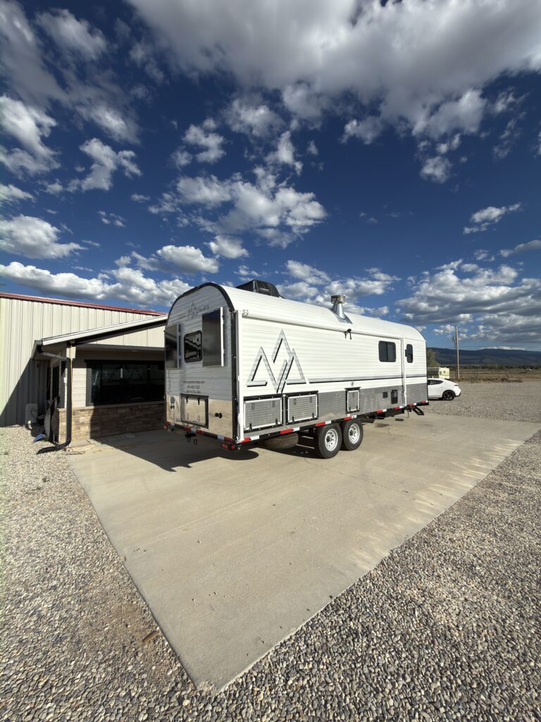 View of the rear curb-side exterior of Gail Camp #131.