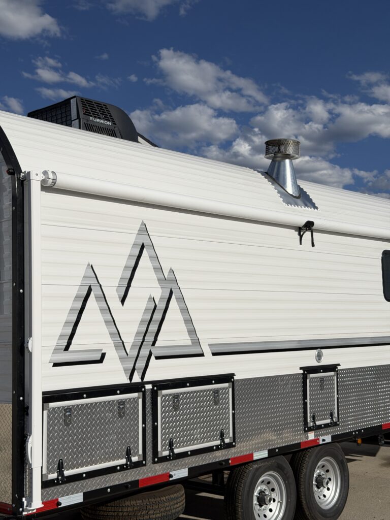 Image of the street-side exterior and storage compartments of Gail Camp #131.