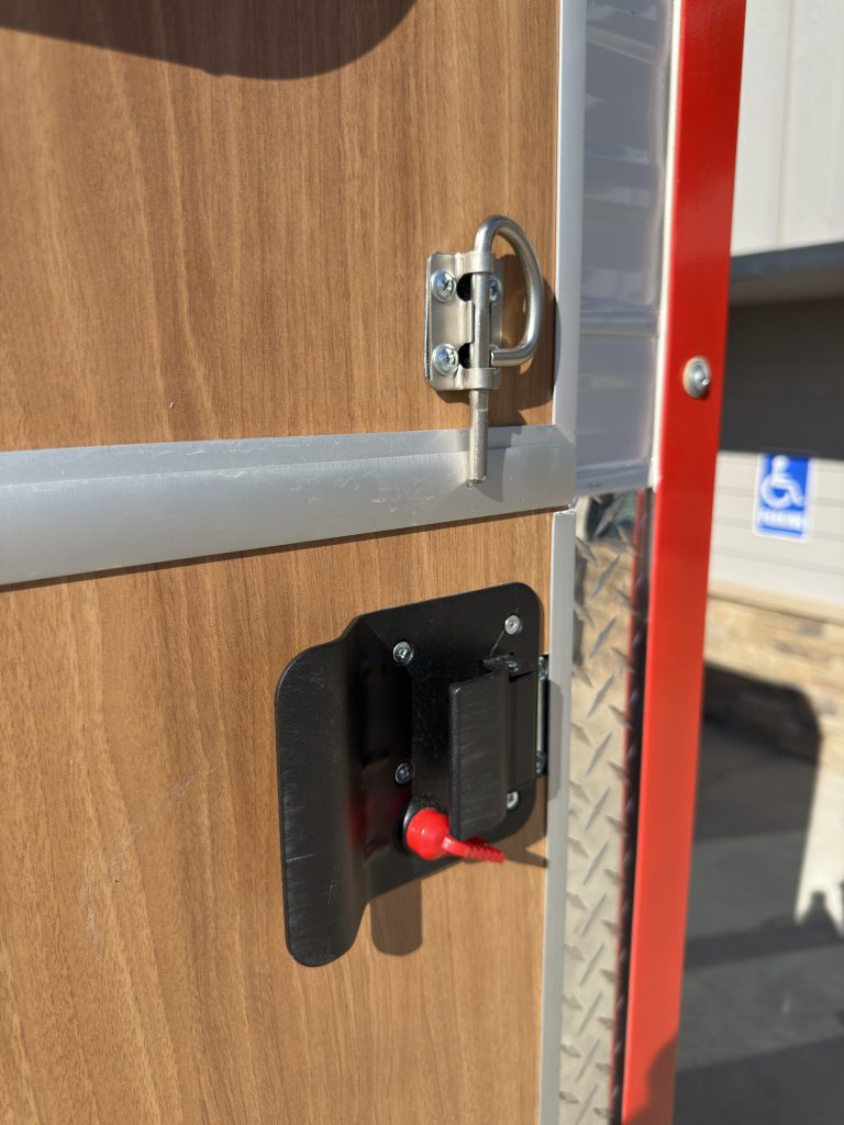Exterior entry door handle and latch on Nielsen Camp #133