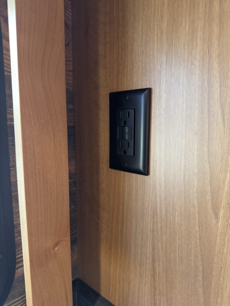 Power outlet at the bar in Nielsen Camp #133