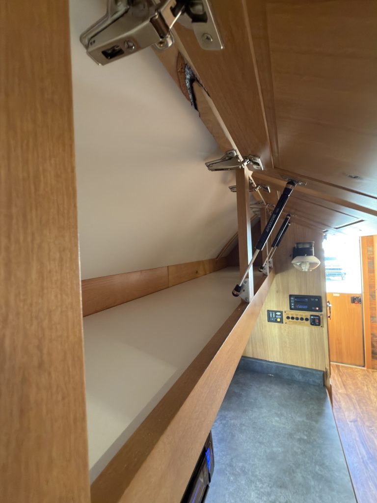 Gas-Strut Cabinet above Bar (Close View) in Nielsen Camp #133
