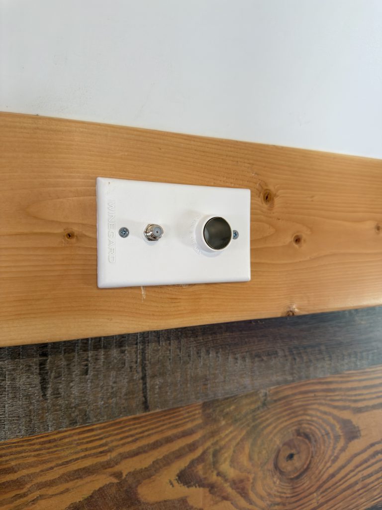 Wall-mounted TV socket and coax connection in Nielsen Camp #133