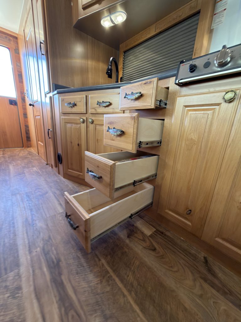 Open Drawers Beside Cooktop in Nielsen Camp #133