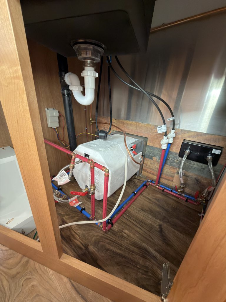 Under-Sink Plumbing Access Framing in Nielsen Camp #133