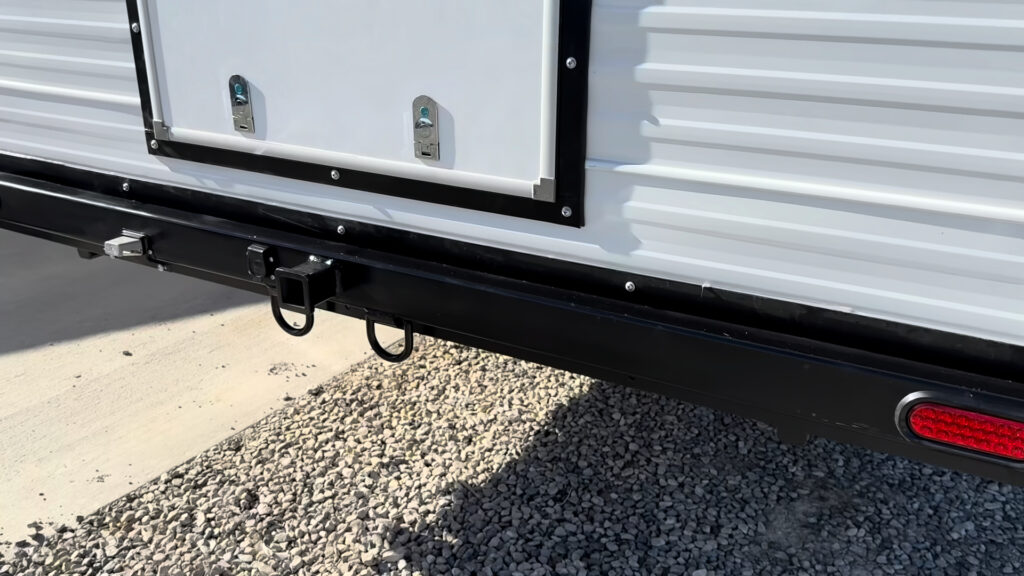 Black rear bumper with a square receiver and hanging loops beneath the rear hatch on Plankis Camp #124.