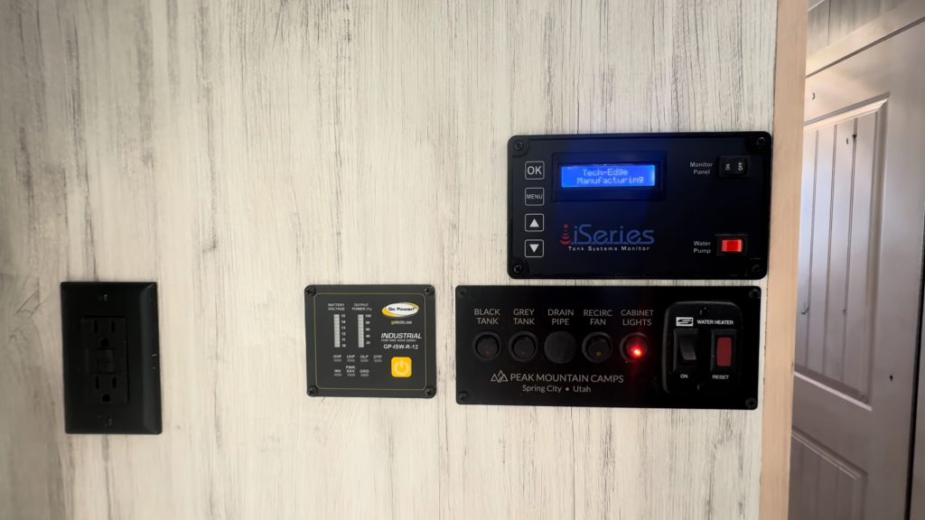 Interior battery and electrical control panels mounted on a wall.