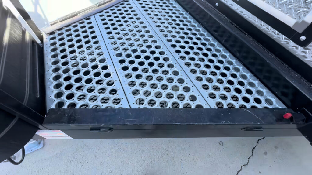 Close view of the perforated metal deck in front of the Kendall Camp entry.