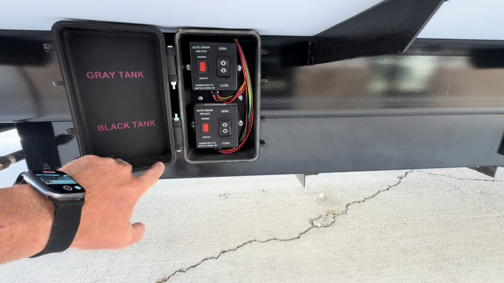Open exterior control box labeled for the Kendall Camp gray and black tank waste gates.