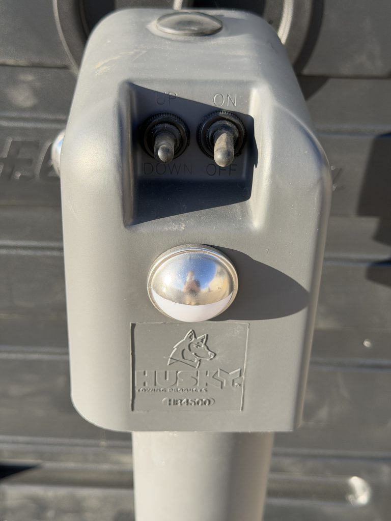 Control buttons and light on the Husky electric tongue jack in Keulen Camp #132.