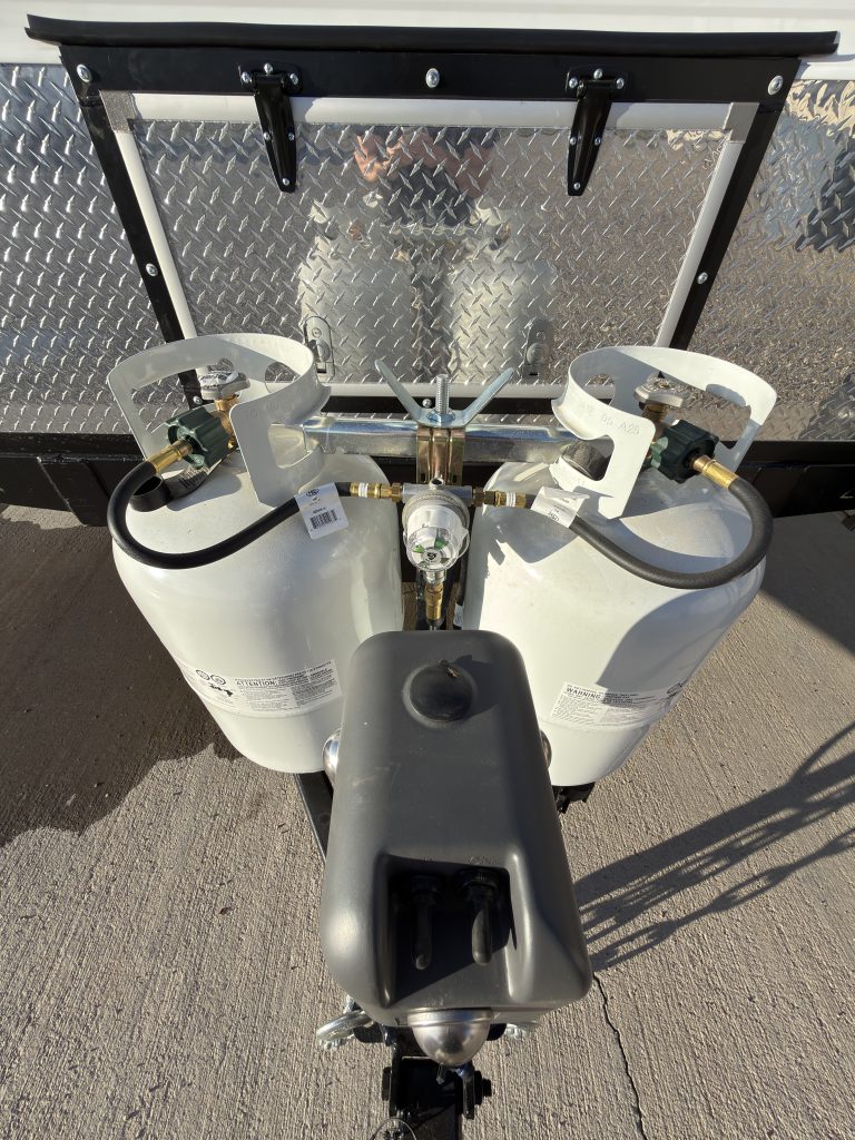 Top view of both propane cylinders and their connections in Keulen Camp #132.