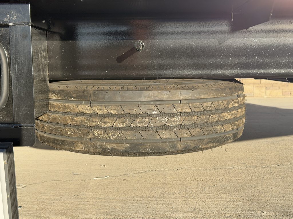 Spare tire mounted beneath the camp frame in Keulen Camp #132.