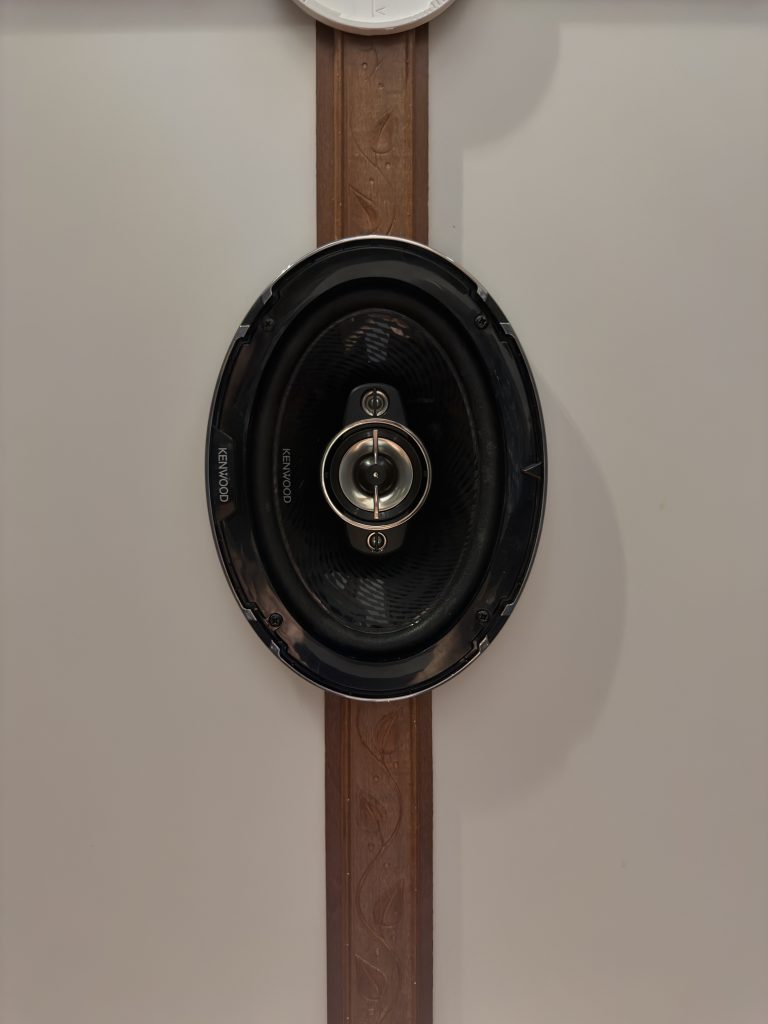 Premium ceiling-mounted Kenwood speaker in rosewood trim in Keulen Camp #132.