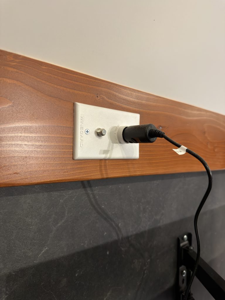 12V DC socket and coax connection for the television above the media center in Keulen Camp #132.