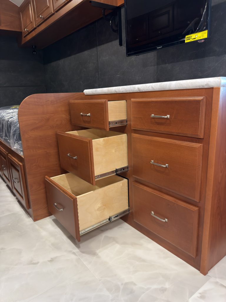 Three drawers extended from the media center beside the entry in Keulen Camp #132.