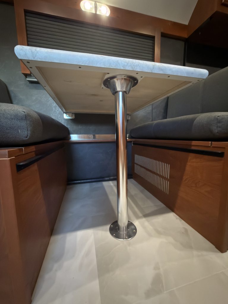 Metal table pedestal beneath the dinette countertop in Keulen Camp #132.