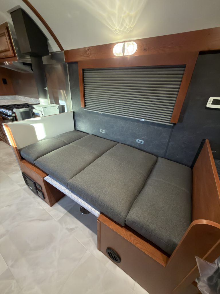 Upholstered cushions arranged across the dinette in Keulen Camp #132.