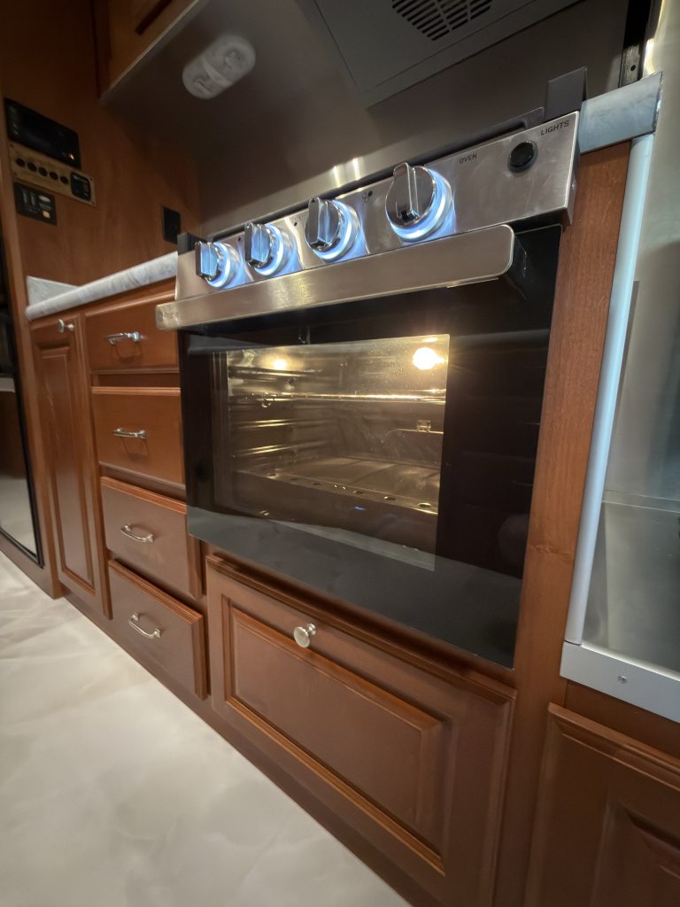 Kitchen oven beside wood drawer fronts in Keulen Camp #132.