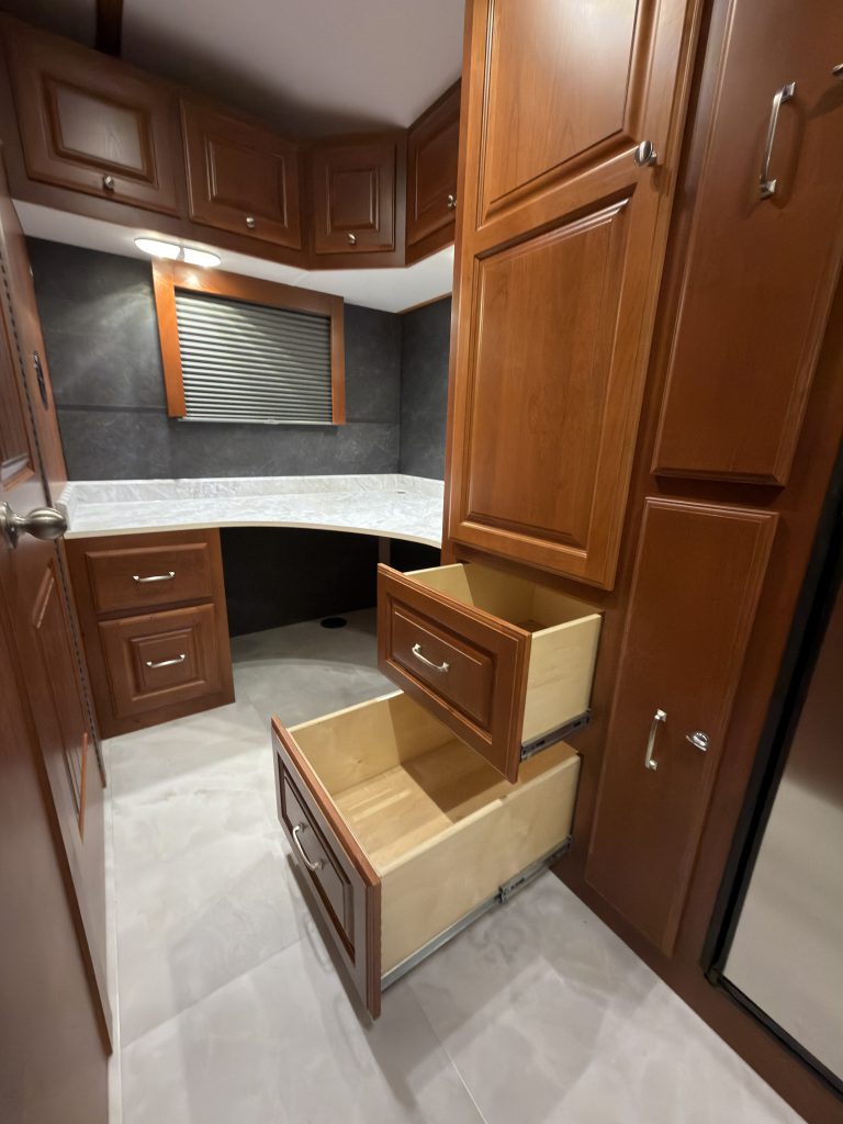 Lower drawers extended from the tall cabinet in Keulen Camp #132.