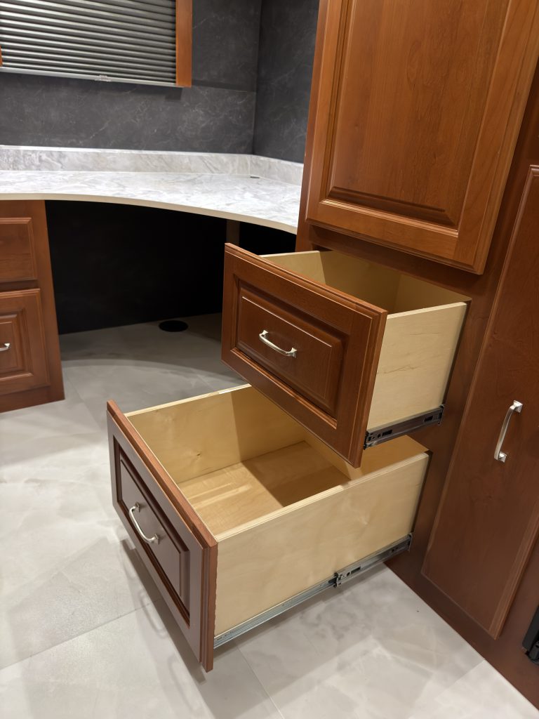 Closer view of two open drawers beside the office desk in Keulen Camp #132.