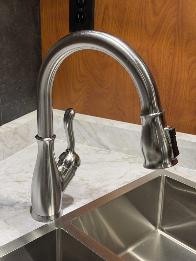 Close angle of the kitchen faucet above the sink in Keulen Camp #132.
