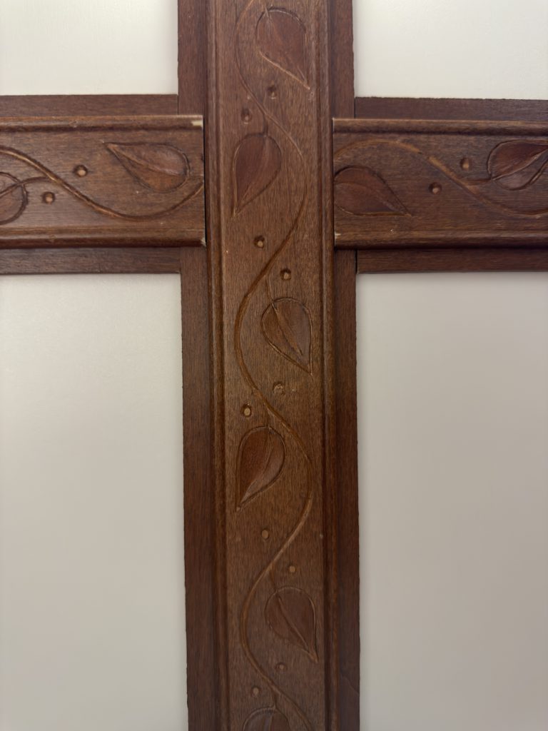 Carved rosewood trim at a ceiling-beam intersection in Keulen Camp #132.