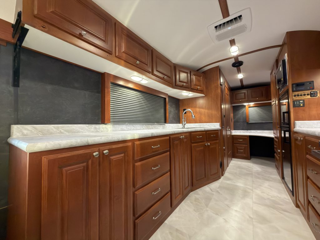 Side view along the long countertop toward the corner office desk in Keulen Camp #132.
