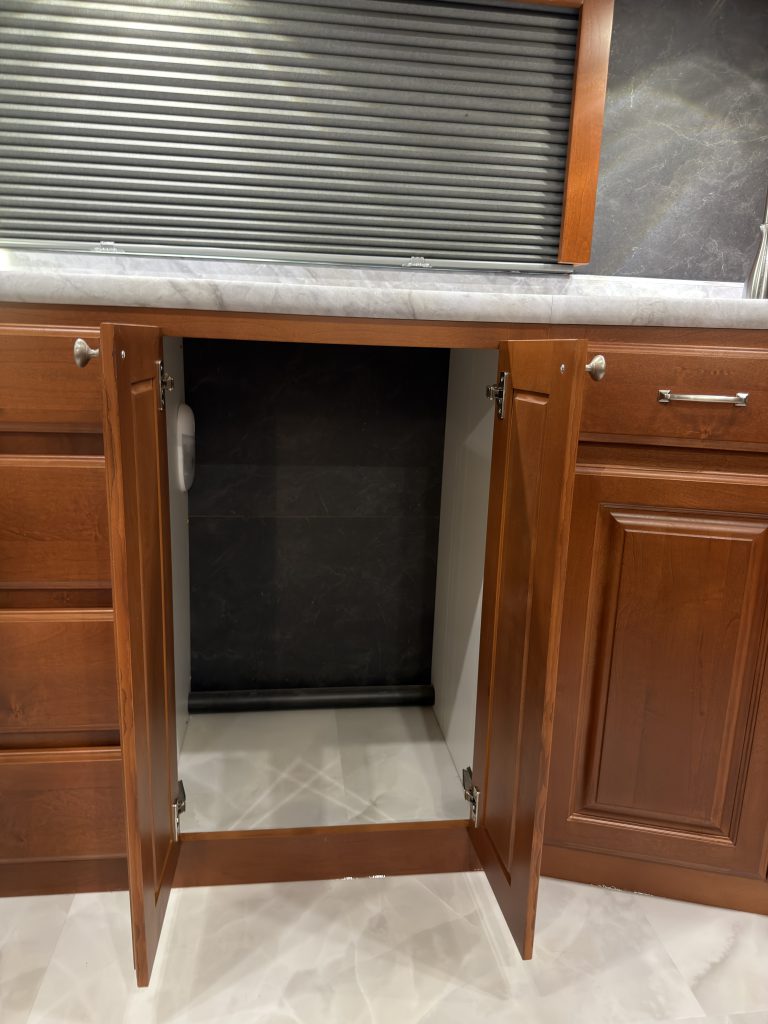 Lower storage opening beneath the sink-side countertop in Keulen Camp #132.