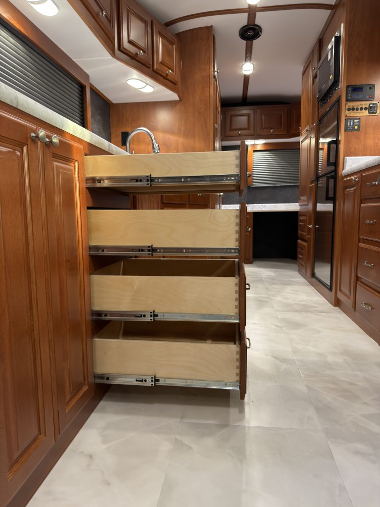 Four drawers extended from the kitchen counter in Keulen Camp #132.