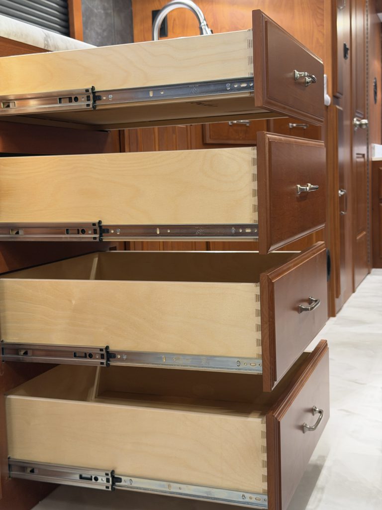 Close view of open drawers and metal runners in Keulen Camp #132.