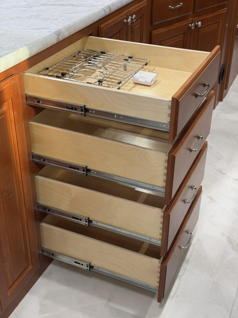 Open drawer stack with papers in the top drawer in Keulen Camp #132.