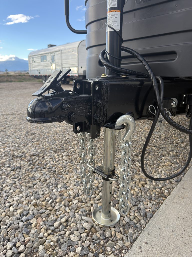 Van Niewkoop Camp #136: Adjustable trailer coupler, Bulldog electric tongue jack, and hitch wiring.