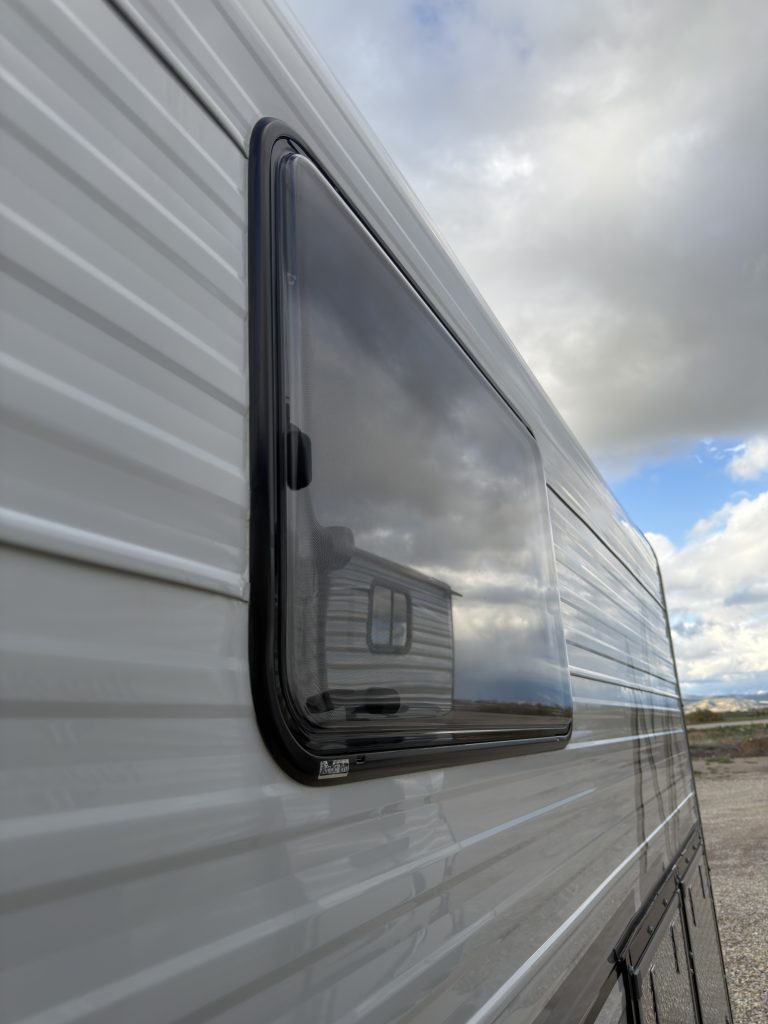 Van Niewkoop Camp #136: Close exterior view of a black-framed, insulated Arctic Tern Classic window.
