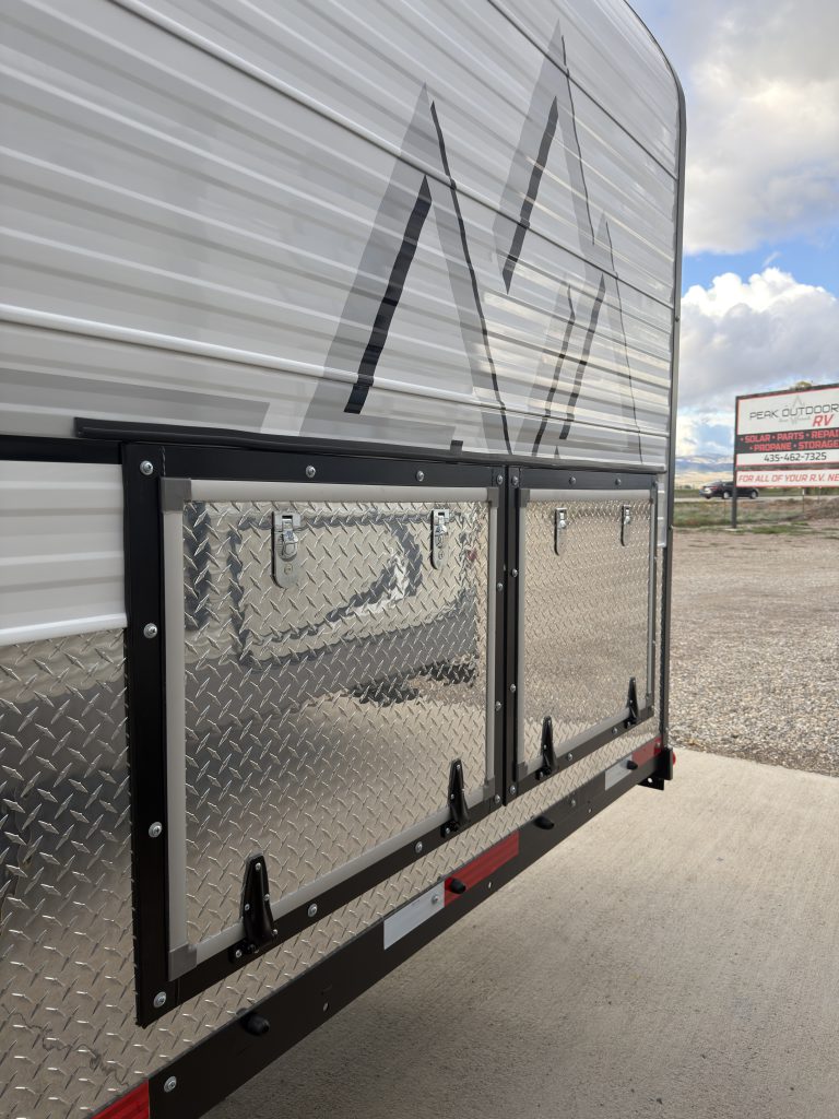 Van Niewkoop Camp #136: Closed two-door roadside storage compartment that houses the battery system.