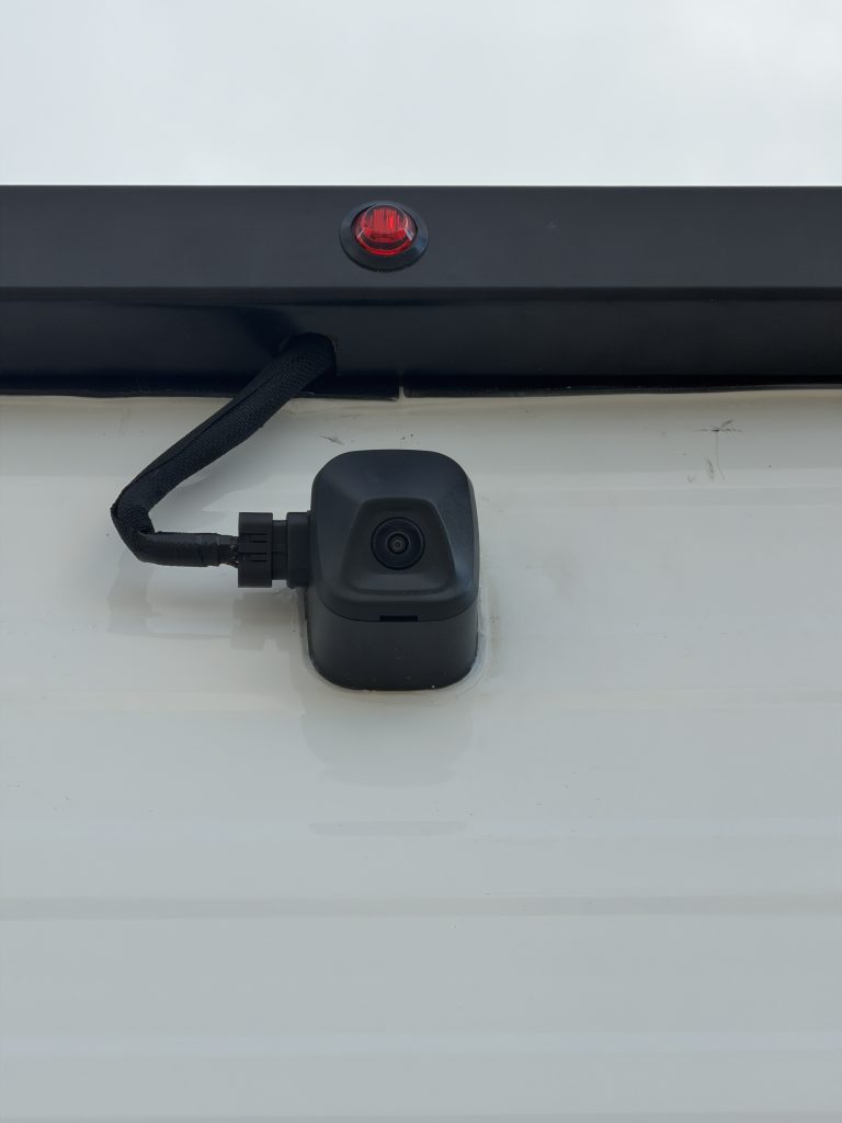 Van Niewkoop Camp #136: Close view of the Ford backup camera and its cable at the rear of the camp.