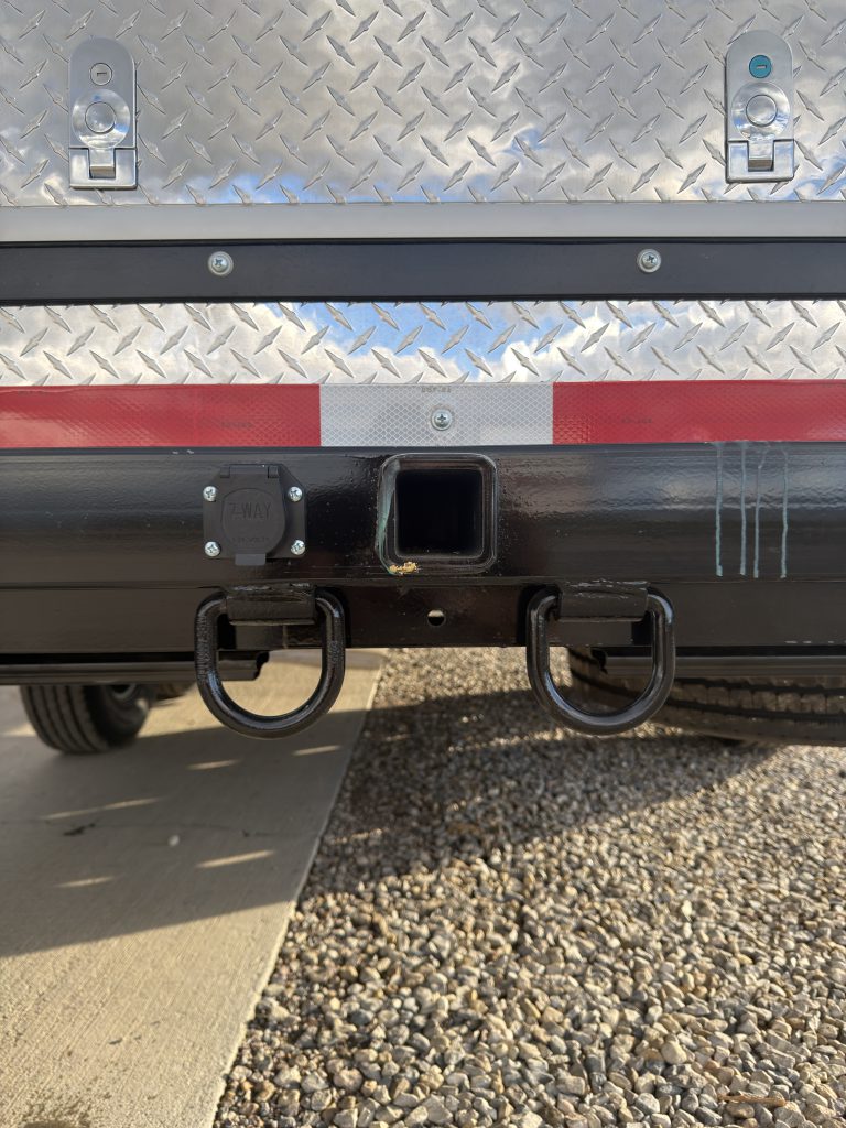 Van Niewkoop Camp #136: Rear 2-inch receiver hitch and attachment loops beneath the bumper.