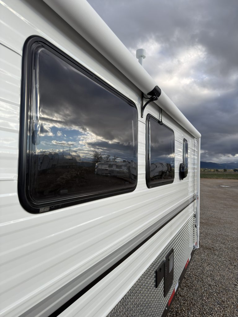 Van Niewkoop Camp #136: Arctic Tern Classic side windows beneath the exterior awning housing.