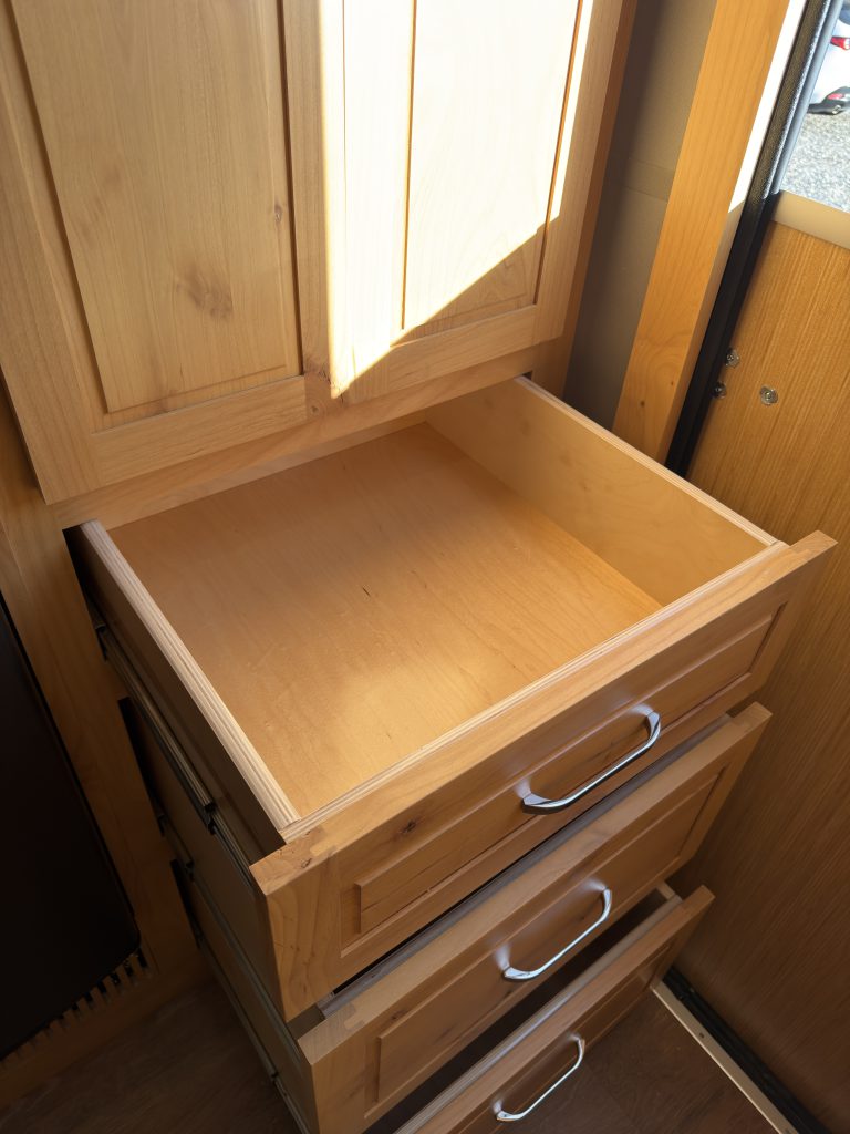 Van Niewkoop Camp #136: Open upper entry drawer showing its wood interior.