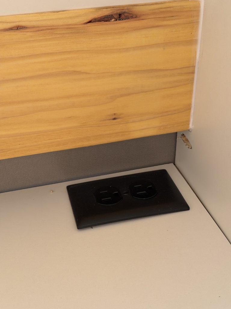 Van Niewkoop Camp #136: AC outlet inside the upper microwave cabinet.