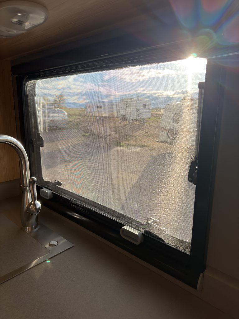 Van Niewkoop Camp #136: Black-framed Arctic Tern Classic window above the kitchen sink and counter.