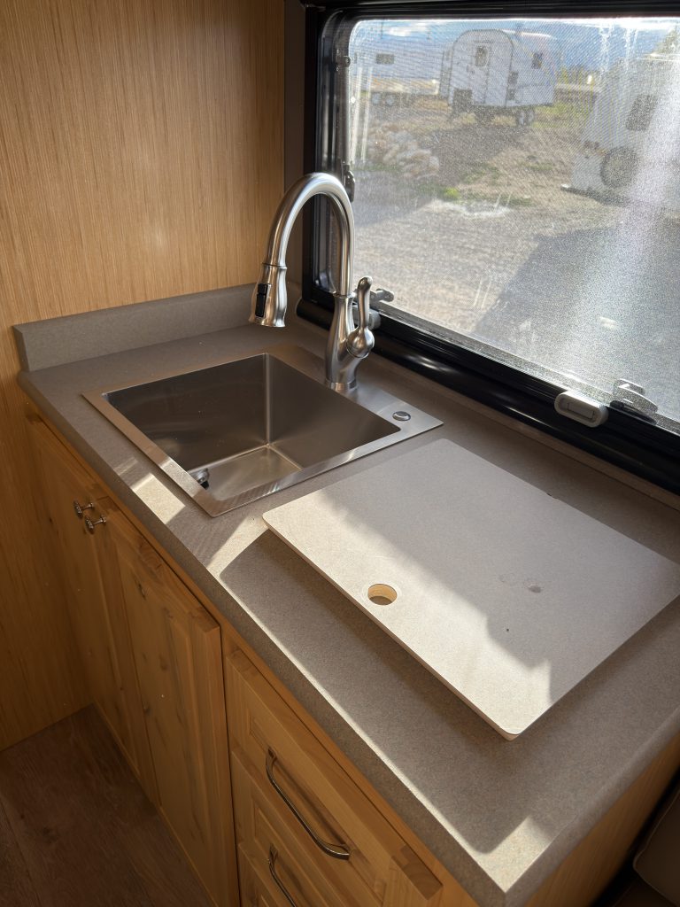 Van Niewkoop Camp #136: Angled view of the kitchen sink, faucet, and fitted countertop cut-out.