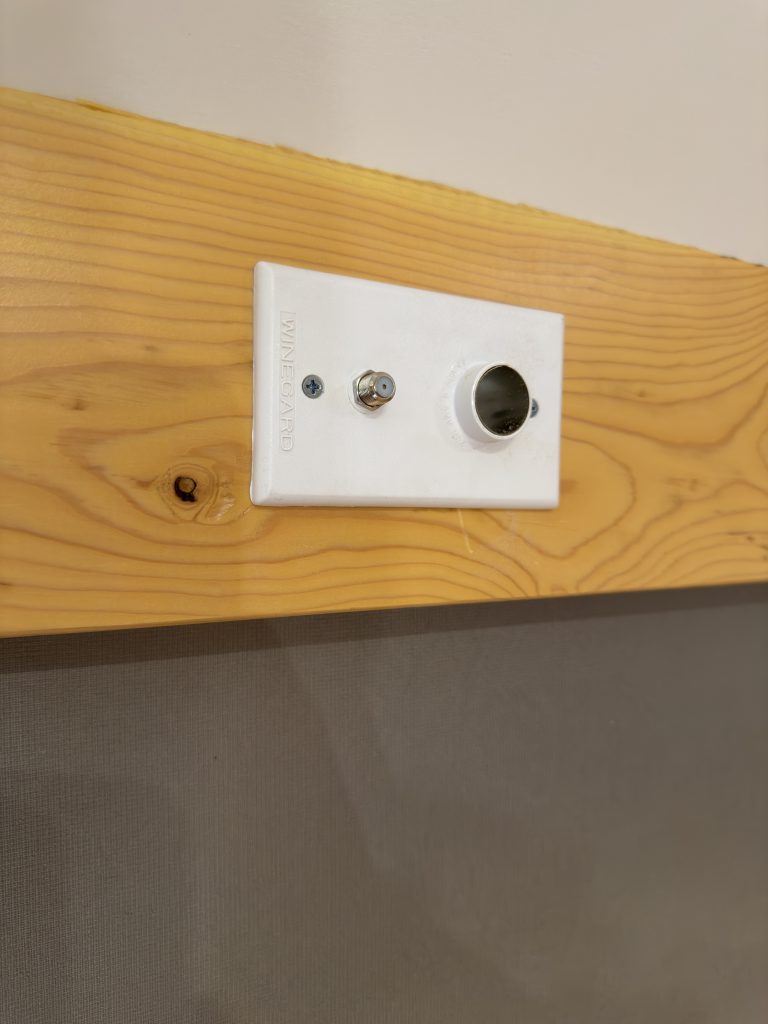 Van Niewkoop Camp #136: Interior DC power socket and coax connection mounted on the wall trim.