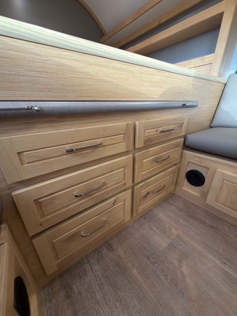 Van Niewkoop Camp #136: Built-in drawers and the pull-out table front beneath the raised bed platform.