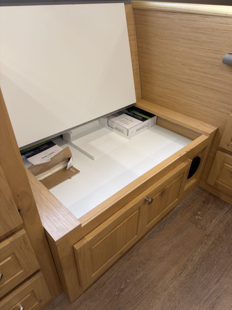 Van Niewkoop Camp #136: Raised bench lid showing the soup-box storage compartment inside.