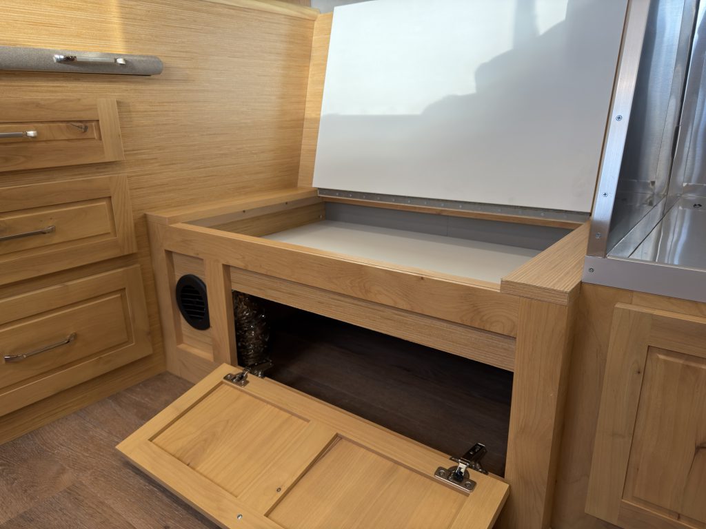 Van Niewkoop Camp #136: Under-bench cabinet with its hinged front panel lowered.