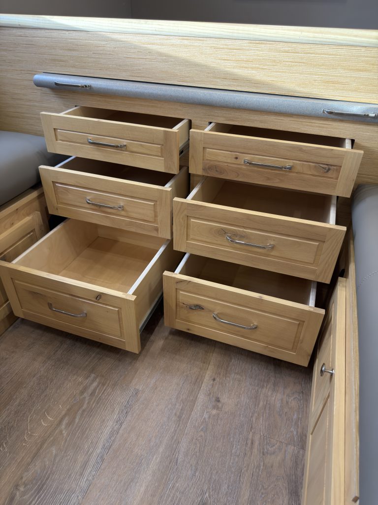 Van Niewkoop Camp #136: Six wood drawers extended beneath the raised California king bed platform.